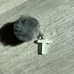 Initial N keychain or backpack charm, white with iridescence, gray pom-pom